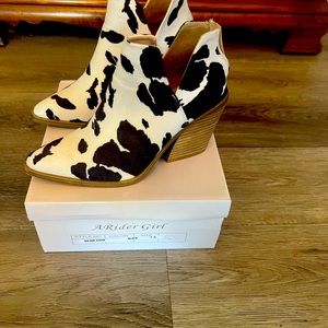 Cow print heeled booties with back zipper
